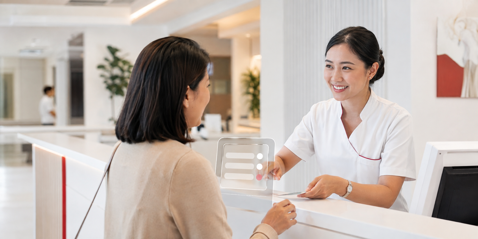 A medical professional assisting a patient at a modern hospital reception